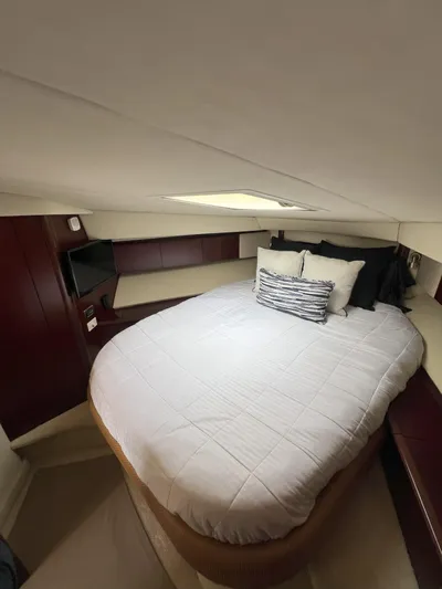 Viva La Vida Yacht Photos Pics Luxurious cabin interior of 2006 Sea Ray 44 Sedan Bridge with cozy bed and modern decor.