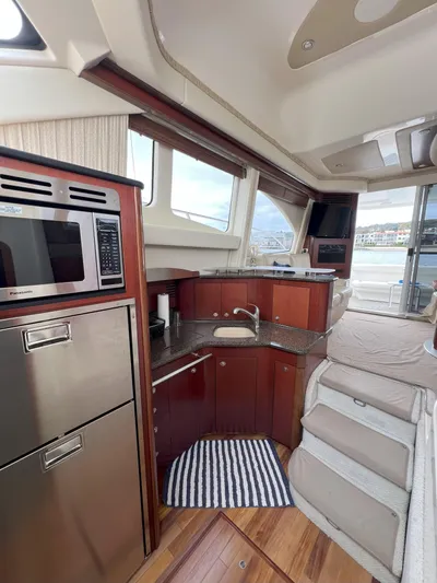 Viva La Vida Yacht Photos Pics Interior of 2006 Sea Ray 44 Sedan Bridge yacht with modern kitchen and stairs.