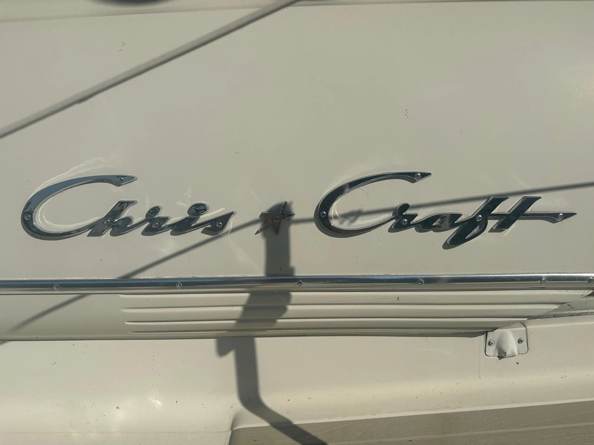 Chris-Craft 35 Commander 1968 emblem on boat hull.