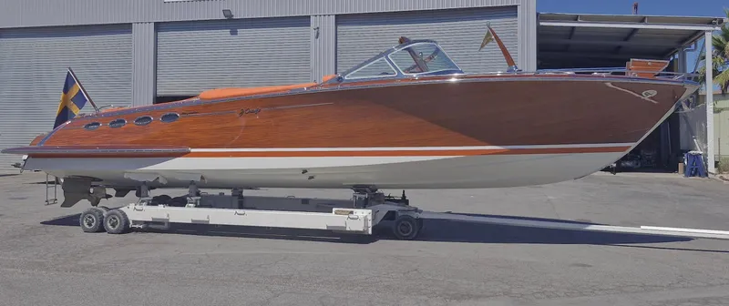  Yacht Photos Pics 2010 J Craft Torpedo 42 boat on trailer, showcasing sleek wooden design and classic elegance.