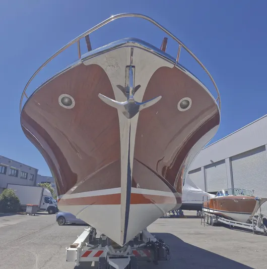  Yacht Photos Pics J Craft Torpedo 42 boat, 2010 model, displayed outdoors on a trailer under clear blue sky.