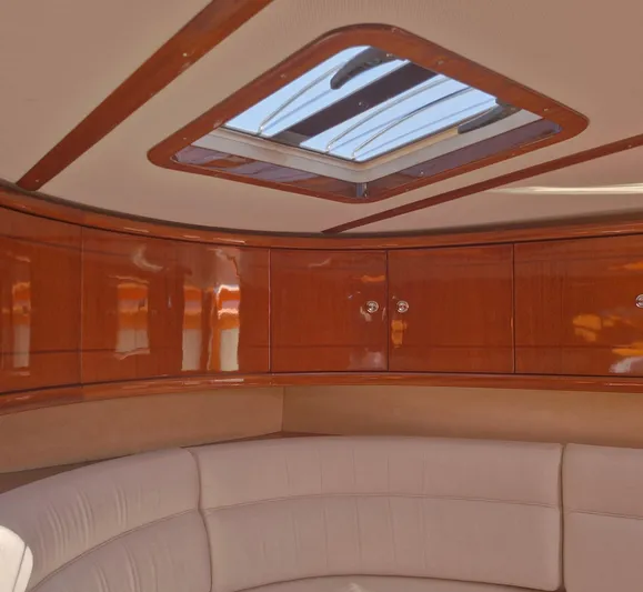  Yacht Photos Pics Luxurious interior of 2010 J Craft Torpedo 42 with polished wood and skylight.