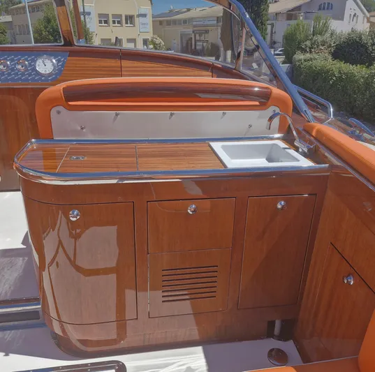  Yacht Photos Pics Luxurious wooden interior of 2010 J Craft Torpedo 42 yacht with sink and cabinetry.