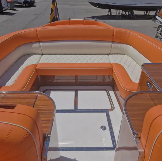  Yacht Photos Pics Luxurious J Craft Torpedo 42 boat interior with orange and white seating, 2010 model.