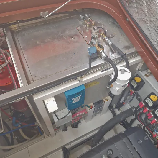  Yacht Photos Pics Engine compartment of a 2010 J Craft Torpedo 42, showcasing mechanical components and wiring.