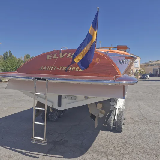  Yacht Photos Pics J Craft Torpedo 42 boat, 2010 model, on trailer with flag, Saint-Tropez branding.