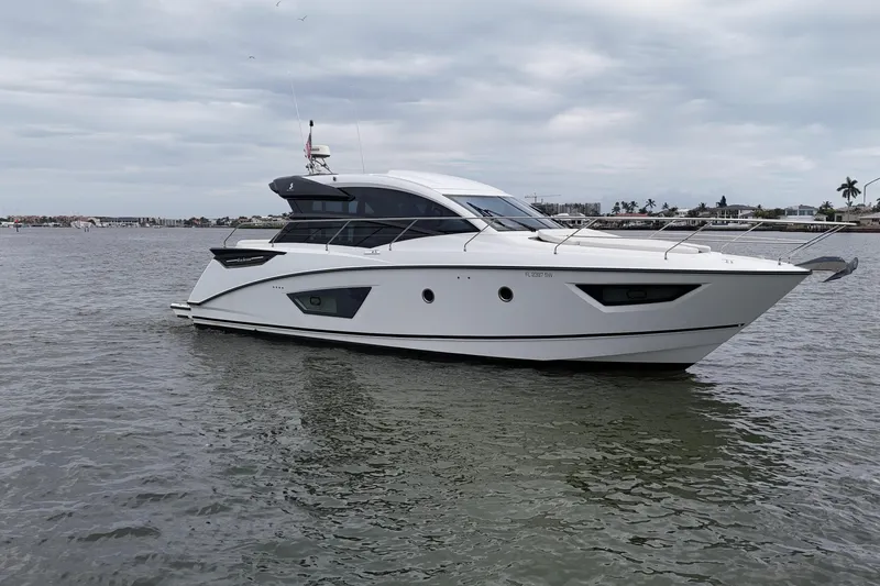 On My Way Yacht Photos Pics 2018 Beneteau Gran Turismo 50 yacht cruising on calm waters under cloudy skies.