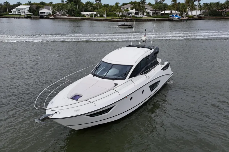 On My Way Yacht Photos Pics 2018 Beneteau Gran Turismo 50 yacht cruising on a scenic waterway.