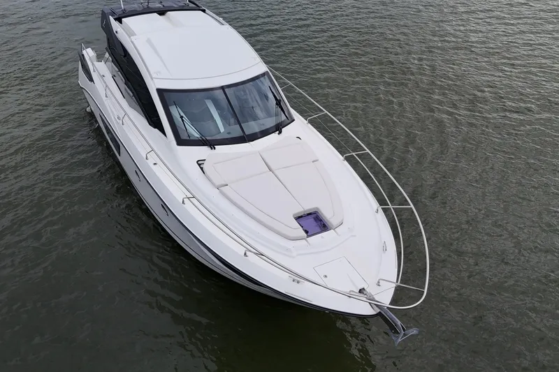 On My Way Yacht Photos Pics 2018 Beneteau Gran Turismo 50 yacht on calm water, aerial view.