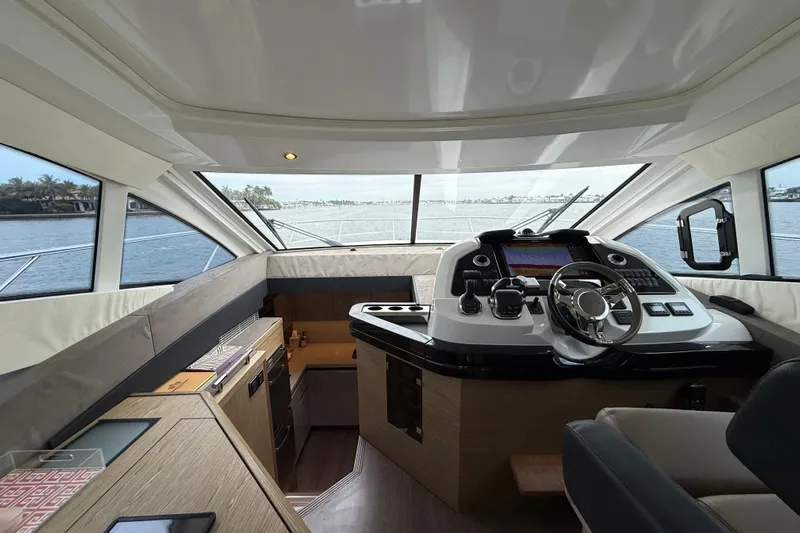 On My Way Yacht Photos Pics 2018 Beneteau Gran Turismo 50 yacht interior with modern helm and panoramic windows.