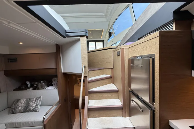 On My Way Yacht Photos Pics Interior of 2018 Beneteau Gran Turismo 50 yacht with modern design and wooden finishes.
