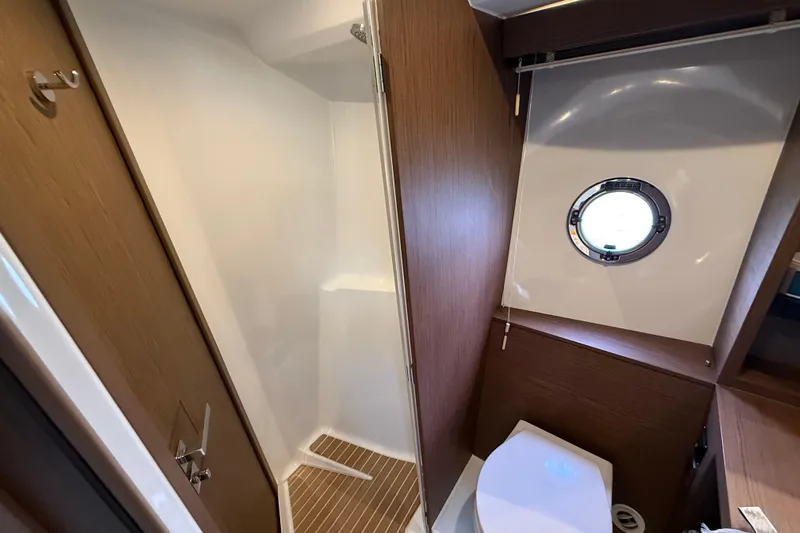 On My Way Yacht Photos Pics Bathroom interior of 2018 Beneteau Gran Turismo 50 yacht with shower and porthole.