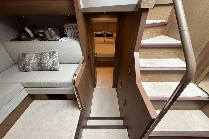 On My Way Yacht Photos Pics Luxurious interior of 2018 Beneteau Gran Turismo 50 yacht with cozy seating and elegant stairs.