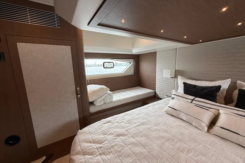 On My Way Yacht Photos Pics Luxurious 2018 Beneteau Gran Turismo 50 yacht bedroom with elegant bedding and window view.