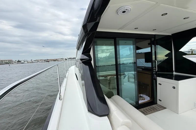 On My Way Yacht Photos Pics 2018 Beneteau Gran Turismo 50 yacht with sleek design, docked by the water.