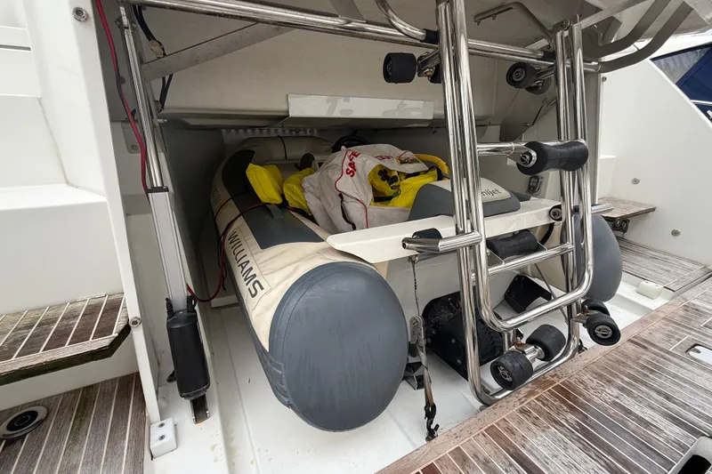 On My Way Yacht Photos Pics Storage compartment of 2018 Beneteau Gran Turismo 50 with inflatable boat and equipment.