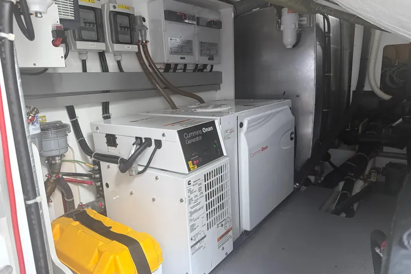 On My Way Yacht Photos Pics Engine room of 2018 Beneteau Gran Turismo 50 with Cummins Onan generator.