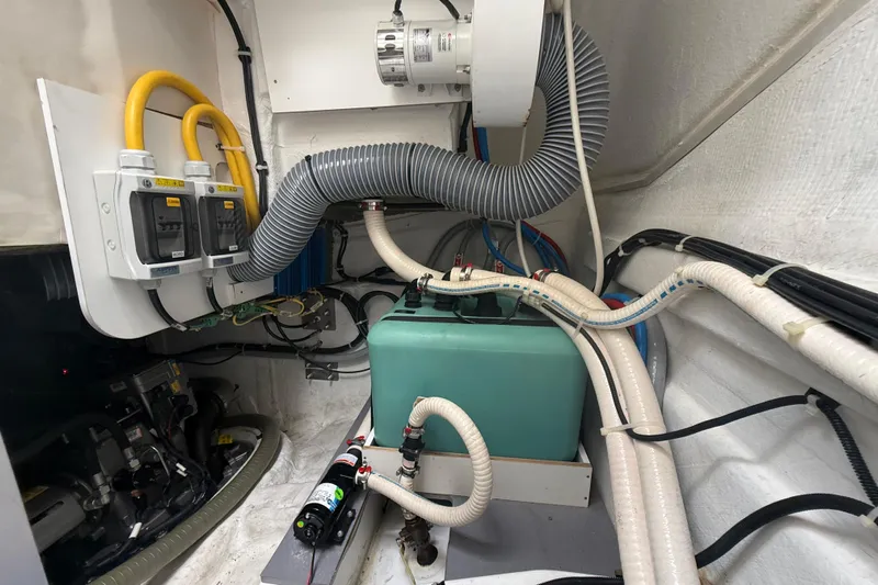 On My Way Yacht Photos Pics Engine room of 2018 Beneteau Gran Turismo 50 with wiring and equipment.