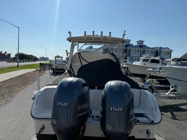  Yacht Photos Pics 2018 Grady-White Freedom 275 boat with twin Yamaha 150 engines, docked outdoors.