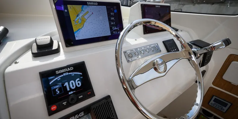  Yacht Photos Pics Modern boat dashboard with Simrad navigation displays and steering wheel, Toy 36 model, 2025.