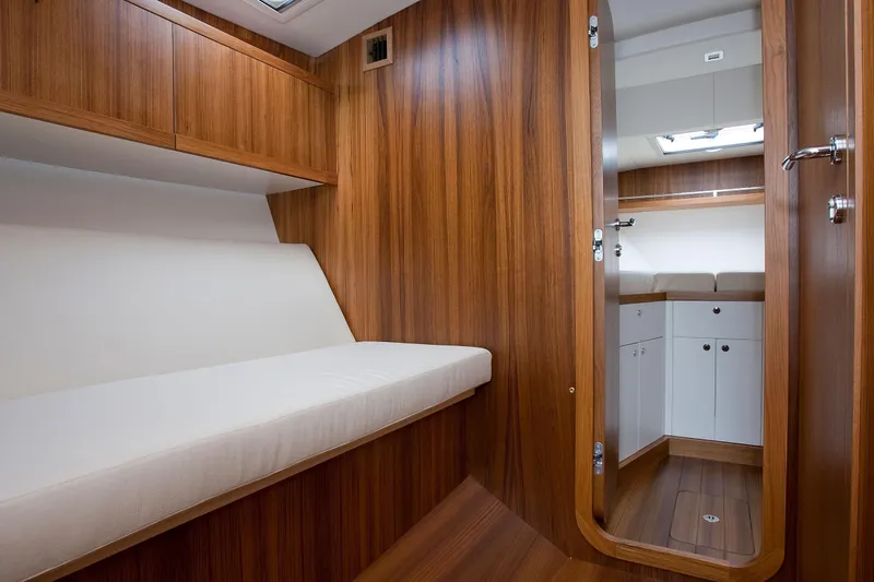  Yacht Photos Pics Wood-paneled cabin interior of Toy 36, 2025 model, featuring a cozy seating area.