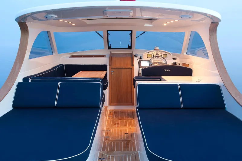  Yacht Photos Pics Luxurious Toy 36 boat interior, 2025 model, featuring elegant seating and modern dashboard.