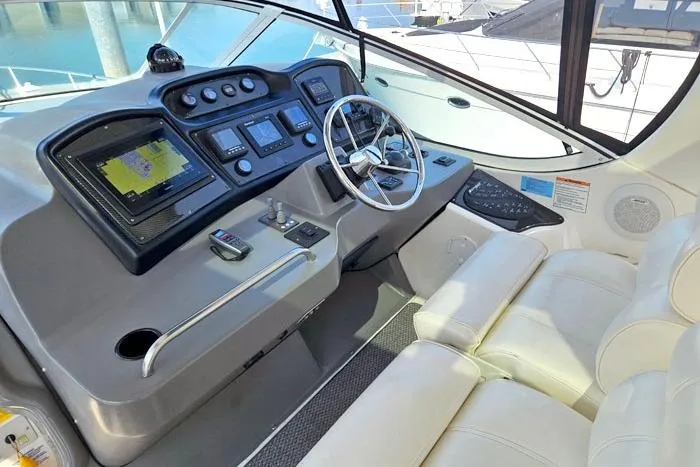  Yacht Photos Pics Helm of 2006 Cruisers Yachts 455 Express Motoryacht with modern navigation equipment.