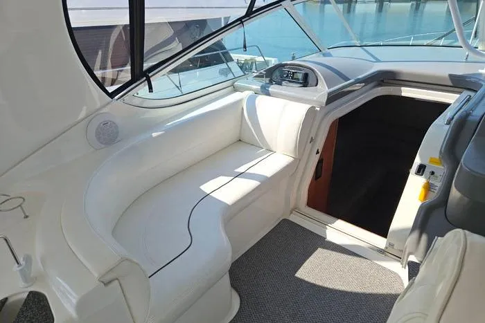  Yacht Photos Pics 2006 Cruisers Yachts 455 Express Motoryacht interior with white seating and helm view.