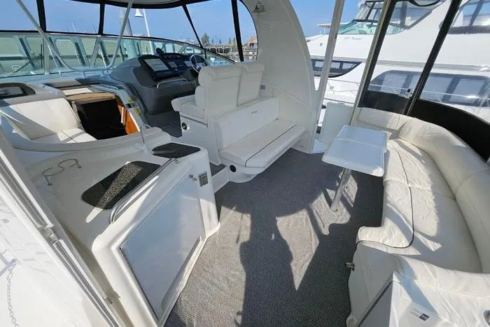 Yacht Photos Pics 2006 Cruisers Yachts 455 Express Motoryacht interior with white seating and helm.