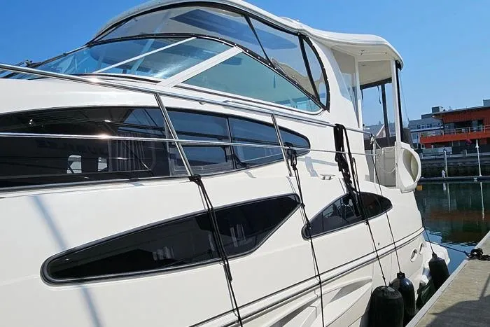  Yacht Photos Pics 2006 Cruisers Yachts 455 Express Motoryacht docked, showcasing sleek design and modern features.