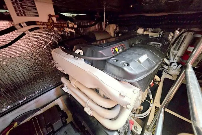  Yacht Photos Pics Engine room of 2006 Cruisers Yachts 455 Express Motoryacht, showcasing detailed machinery.