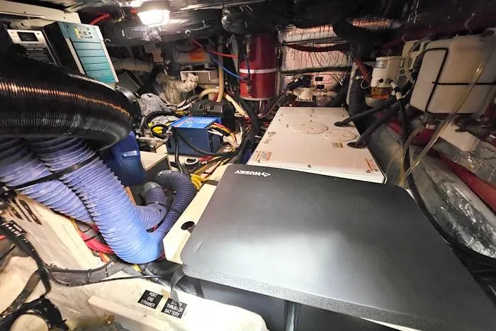  Yacht Photos Pics Engine room of 2006 Cruisers Yachts 455 Express Motoryacht with various equipment and wiring.