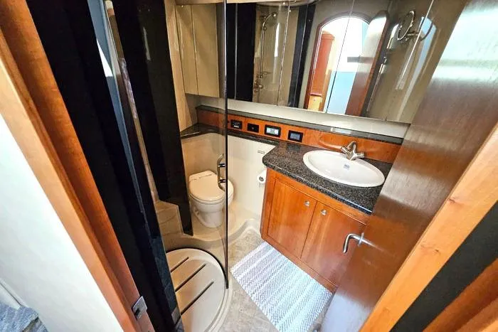  Yacht Photos Pics Luxurious bathroom in 2006 Cruisers Yachts 455 Express Motoryacht with modern amenities.