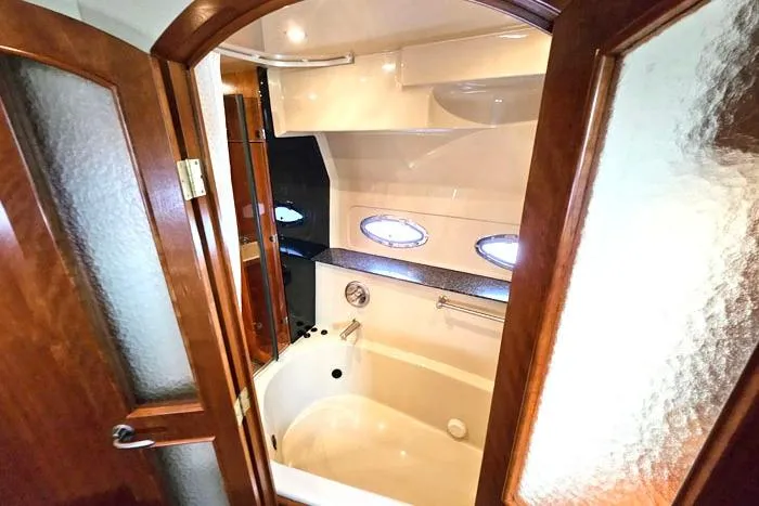  Yacht Photos Pics Luxurious bathroom in 2006 Cruisers Yachts 455 Express Motoryacht with elegant wood accents.