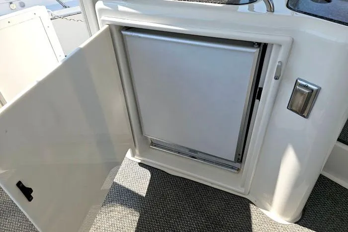  Yacht Photos Pics Open cabinet with mini fridge on 2006 Cruisers Yachts 455 Express Motoryacht.