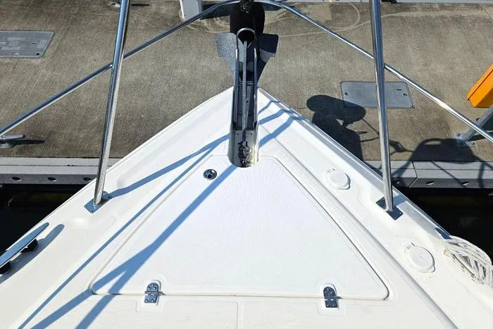  Yacht Photos Pics 2006 Cruisers Yachts 455 Express Motoryacht bow at dock, featuring stainless steel railings.