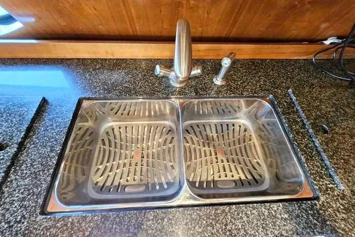  Yacht Photos Pics Stainless steel double sink in 2006 Cruisers Yachts 455 Express Motoryacht kitchen.