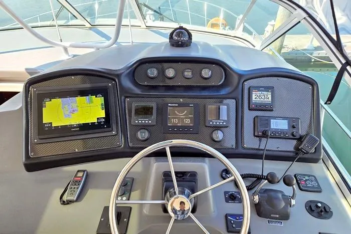  Yacht Photos Pics 2006 Cruisers Yachts 455 Express Motoryacht helm with navigation and control systems.