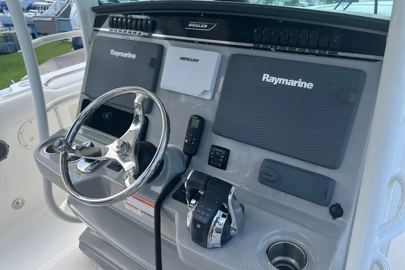  Yacht Photos Pics 2014 Boston Whaler 350 Outrage Helm from Starboard with all Electronics Covers on