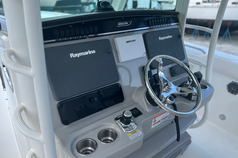  Yacht Photos Pics 2014 Boston Whaler 350 Outrage Helm from Port with all Electronics Covers on