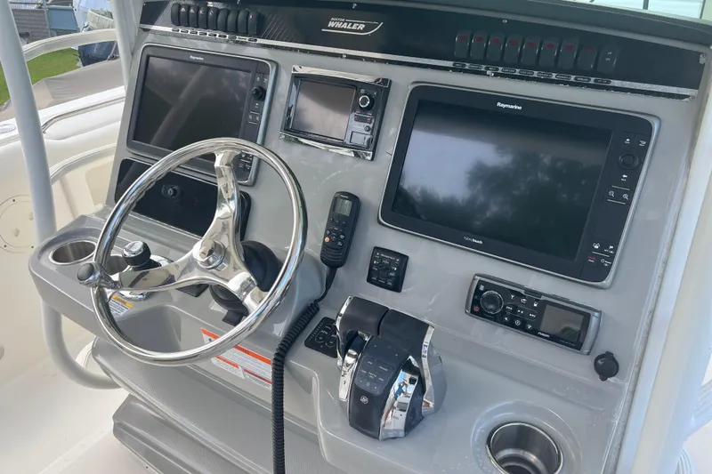  Yacht Photos Pics 2014 Boston Whaler 350 Outrage Helm from Starboard with electronics uncovered