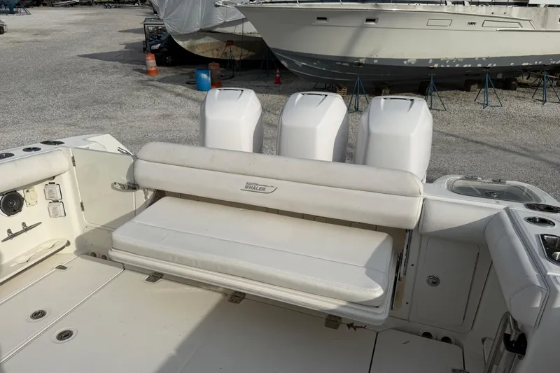  Yacht Photos Pics 2014 Boston Whaler 350 Outrage cockpit with rear bench seat open, looking from port side