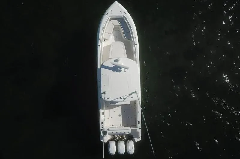  Yacht Photos Pics Aerial view of 2014 Boston Whaler 350 Outrage boat on dark water.