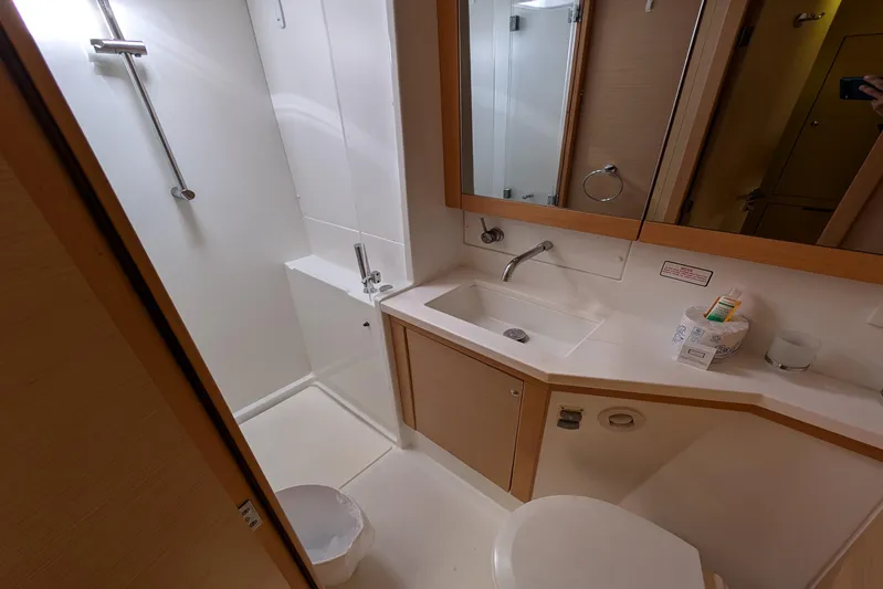  Yacht Photos Pics Modern bathroom in 2015 Lagoon 450 yacht with shower, sink, and toilet.