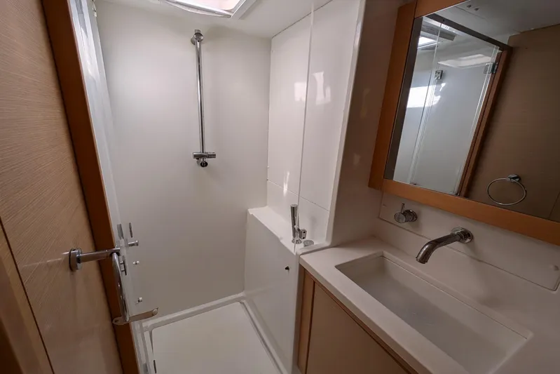  Yacht Photos Pics Bathroom interior of 2015 Lagoon 450 yacht with shower and sink.