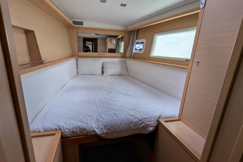  Yacht Photos Pics Interior cabin of 2015 Lagoon 450 catamaran with cozy bed and modern design.