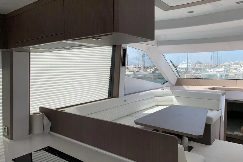  Yacht Photos Pics Luxurious interior of 2019 Galeon 500 Fly yacht with modern seating and large windows.