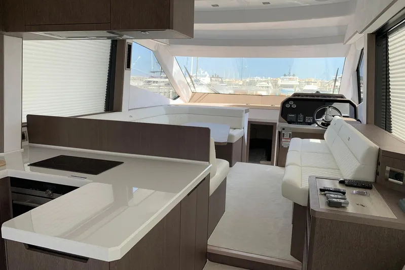  Yacht Photos Pics Luxurious interior of 2019 Galeon 500 Fly yacht with modern kitchen and helm.