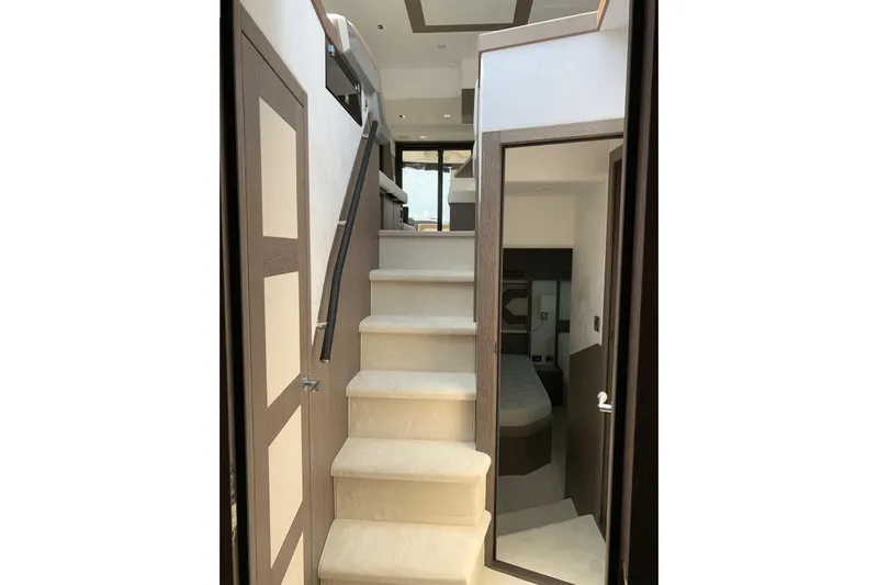  Yacht Photos Pics Interior staircase of 2019 Galeon 500 Fly yacht, leading to luxurious cabin.