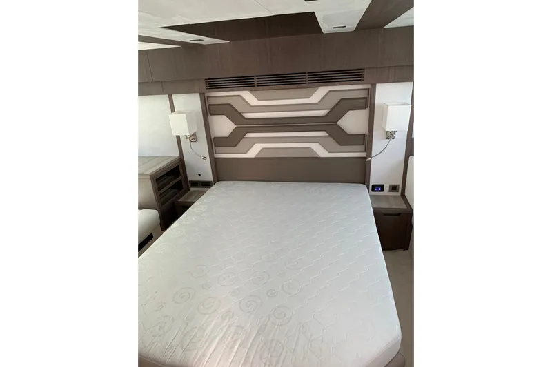  Yacht Photos Pics Luxurious bedroom interior of 2019 Galeon 500 Fly yacht with modern design elements.